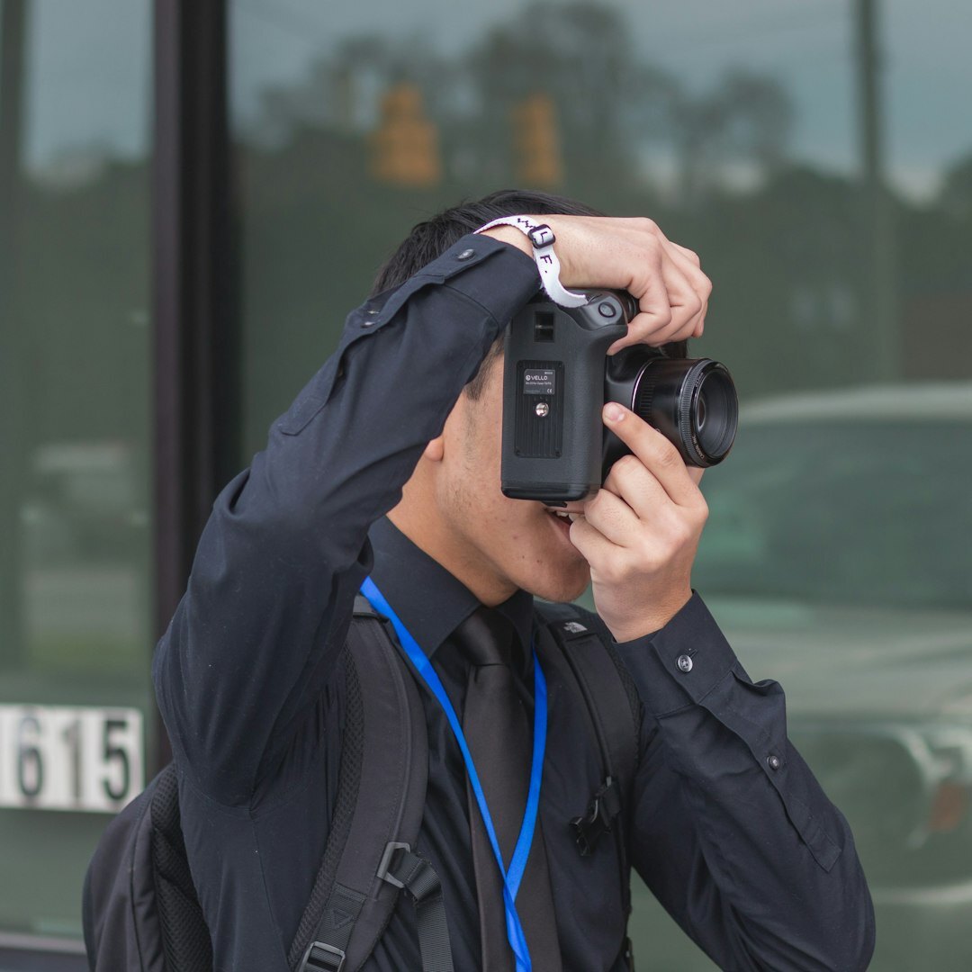Portrait of a male camera security instructor